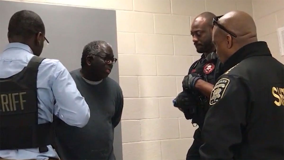 Clayton County Sheriff Victor Hill speaks with Joseph Arnold 