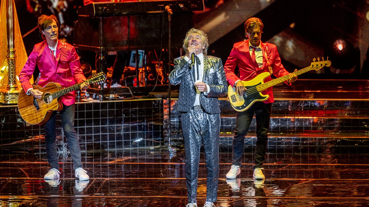 Rod Stewart performing with band