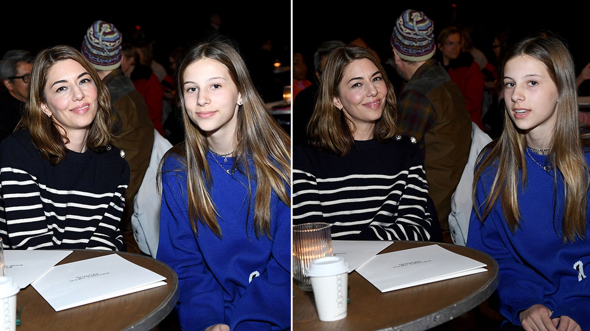 Sofia Coppola smiles in a navy blue and white striped sweater next to daughter Romy in a royal blue sweater sitting at a table for the Marc Jacobs runway show (two pictures)