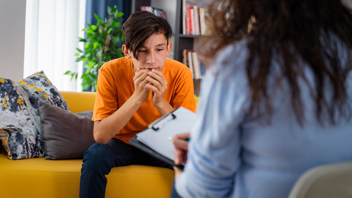 Teenage boy with doctor