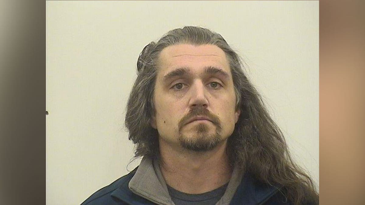 Timothy Bliefnick, long hair, goatee in mug shot