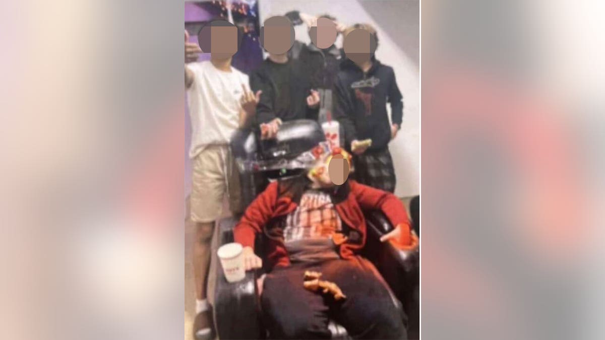 Trent Lehrkamp shown passed out in a chair with items and substances on him
