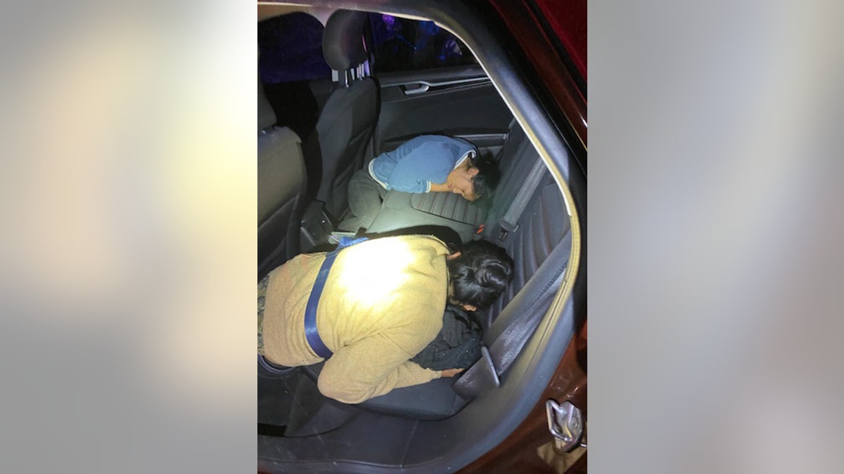 Two illegals found in backseat of car