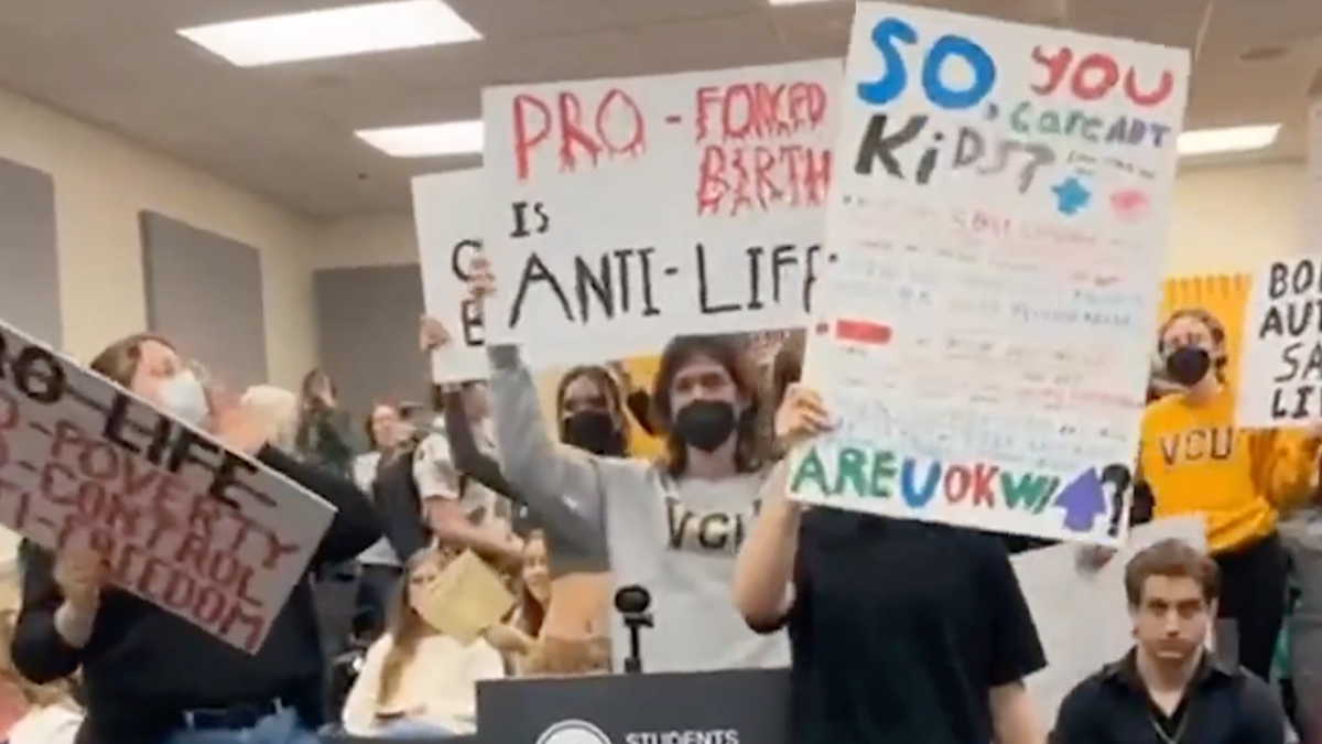 VCU protesters holding signs and shouting