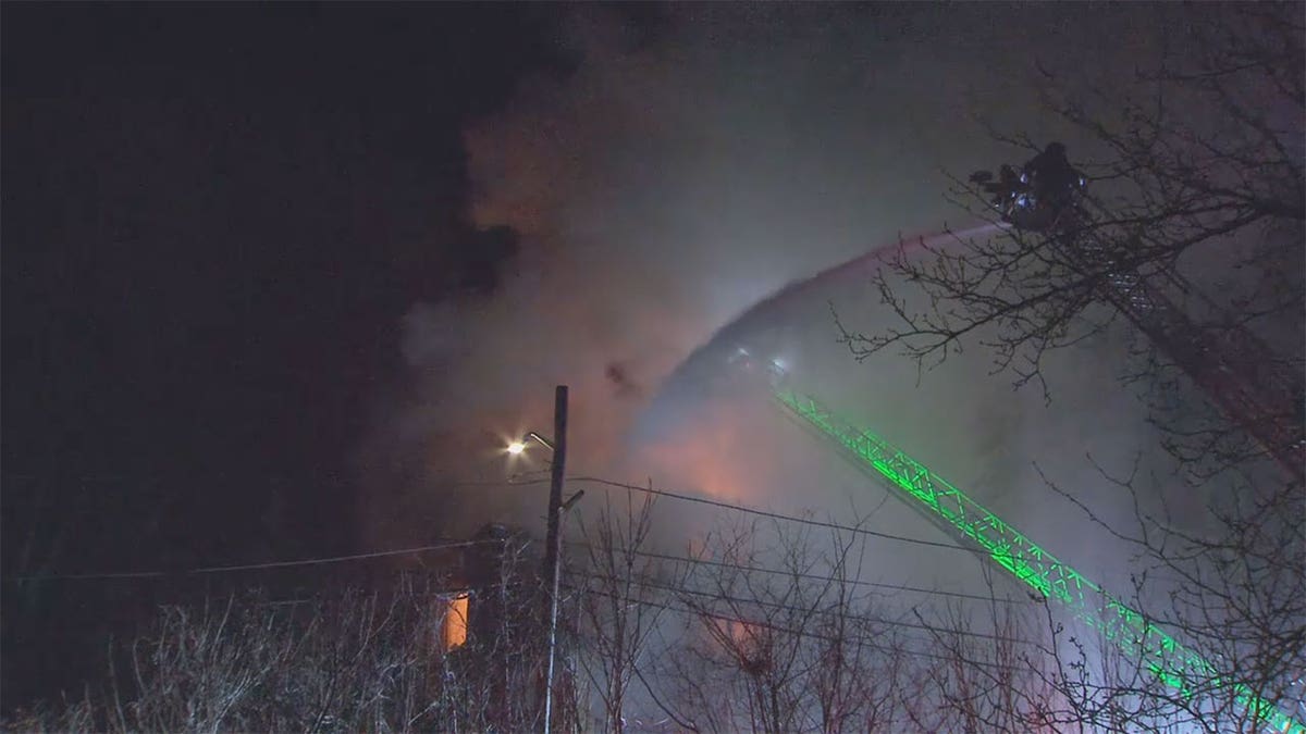 Firefighters respond to a Medford home owned by Sen. Elizabeth Warren's son. 