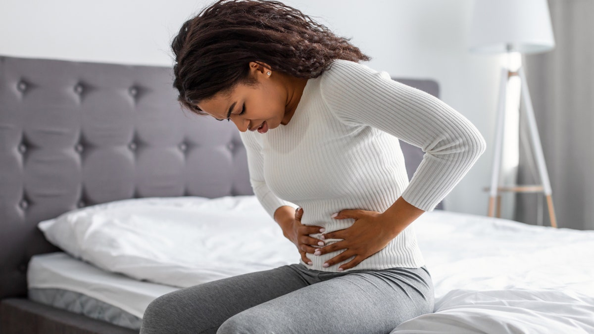 Woman with stomach pain