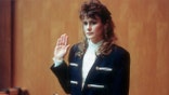 Pamela Smart raises her right hand while testifying in court during her 1991 murder trial in New Hampshire.