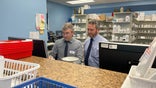 John Seymour stands with employees at one of his independent pharmacies in Virginia.