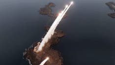 North Korean troops simulate attack on South Korea, as Kim looks on