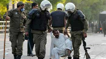 Pakistani police fire tear gas, use water cannons to disperse supporters of former Prime Minister Imran Khan