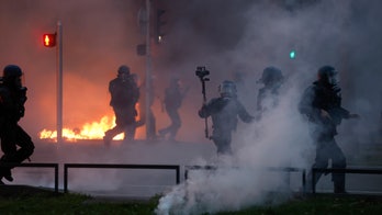 Macron faces 800,000-person protest in Paris over pension reform