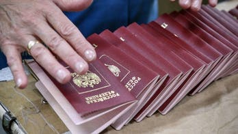 Russian officials having passports seized due to flight concerns
