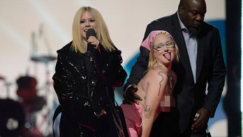 Avril Lavigne tells topless protester to 'get the f--- off' the stage while presenting at Juno Awards