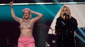 Avril Lavigne environmental protester defends topless stunt: 'We created an international buzz'