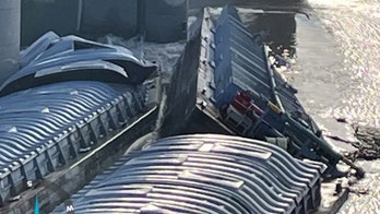 Runaway Kentucky barge carrying methanol, 2 others pinned against dam site