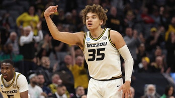 Missouri pulls away late to beat Utah State in March Madness