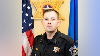 Oklahoma deputy 'died three times' after patrol car hit security gate, in stable condition, sheriff says
