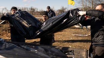 Bodies exhumed from makeshift graves in Ukrainian towns once occupied by Russian troops