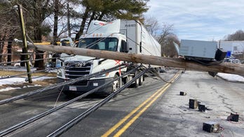 Driver trapped under downed utility wires near Boston