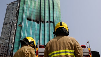 Hong Kong skyscraper fire could mean $64M payout, cause under investigation