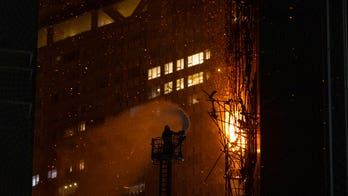 Residents evacuated, neighboring buildings consumed by Hong Kong skyscraper fire