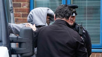 UK couple to remain in custody after authorities find remains of an infant inside a nearby garden shed