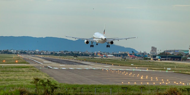 Airplane taking off from tarmac during daytime