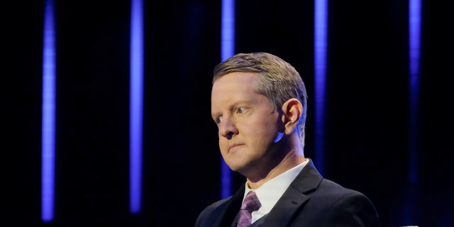 Ken Jennings gives a disapproving look on a game show set.