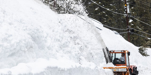 A snowblower removes snow in Tahoe City, Calif., Tuesday, March 14, 2023. 