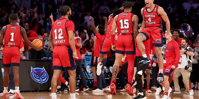 Bryan Greenlee (4) and Alijah Martin (15) of the Florida Atlantic Owls celebrate after defeating the Kansas State Wildcats in the Elite Eight of the NCAA Tournament at Madison Square Garden March 25, 2023, in New York City. 