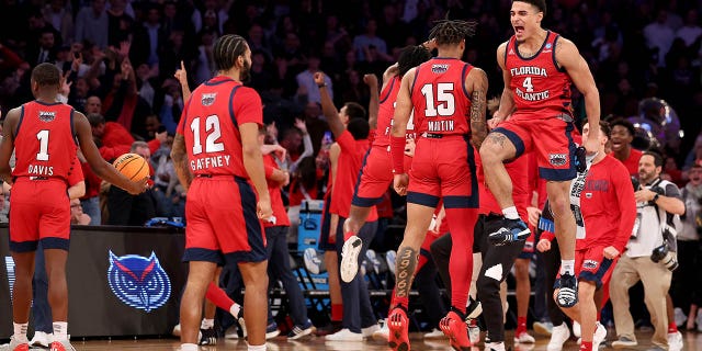 Bryan Greenlee (4) and Alijah Martin (15) of the Florida Atlantic Owls celebrate after defeating the Kansas State Wildcats in the Elite Eight of the NCAA Tournament at Madison Square Garden March 25, 2023, in New York City. 