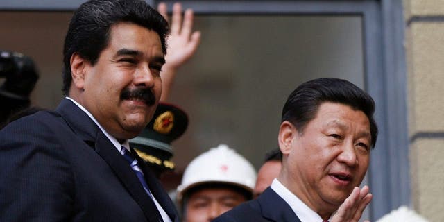 China will provide Venezuela with a $4 billion credit line under a deal signed on Monday, with the money to be repaid with oil shipments from OPEC member Venezuela.  The deal was sealed during a 24-hour visit to Venezuela by Chinese President Xi Jinping, right, who is touring Latin America.