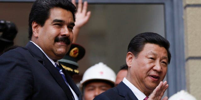 China will provide Venezuela with a $4 billion credit line under a deal signed on Monday, with the money to be repaid with oil shipments from OPEC member Venezuela.  The deal was sealed during a 24-hour visit to Venezuela by Chinese President Xi Jinping, right, who is touring Latin America.