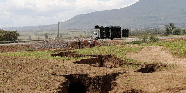 A truck drives close to a chasm near the Rift Valley town of Mai Mahiu, Kenya, March 28, 2018.