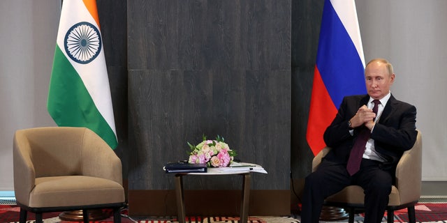 Russian President Vladimir Putin waits before a meeting with Indian Prime Minister Narendra Modi on the sidelines of the Shanghai Cooperation Organization (SCO) summit in Samarkand, Uzbekistan, September 16, 2022. 