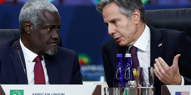 U.S. Secretary of State Antony Blinken speaks with African Union Commission (AUC) Chairperson Moussa Faki Mahamat during the working lunch on multilateral cooperation at the U.S.-Africa Leaders Summit, in Washington, U.S., December 15, 2022. REUTERS/Evelyn Hockstein