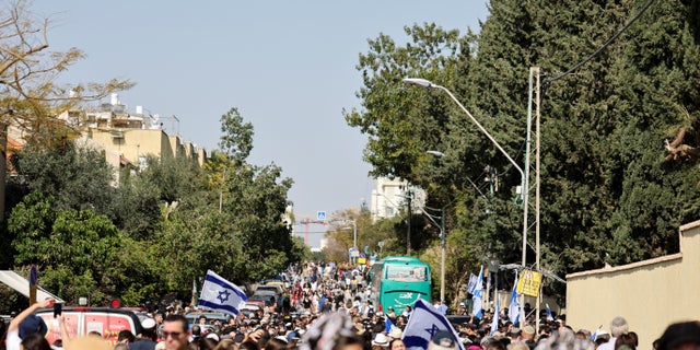 Over a thousand people mourn Elan Ganeles, a dual U.S.-Israeli citizen killed in a shooting attack while he was driving near the West Bank city of Jericho by terrorists, during his funeral, outside the cemetery, in Raanana, Israel, March 1, 2023. REUTERS/Nir Elias