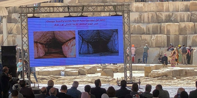 An image of a hidden corridor inside the Great Pyramid of Giza is displayed during a news conference led by the Egyptian Minister of Tourism and Antiquities Ahmed Issa.