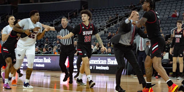 UT Martin's Rifen Miguel, left, lunges for SIU-Edwardsville's DeeJuan Pruitt, right, in the first half of their game for the second round of the Ohio Valley Conference at Ford Center in Evansville, Indiana, Thursday night, March 2, 2023.