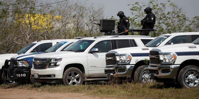 Police officers guard the scene where authorities found the bodies of two of four Americans kidnapped by gunmen, in Matamoros, Mexico on March 7, 2023.