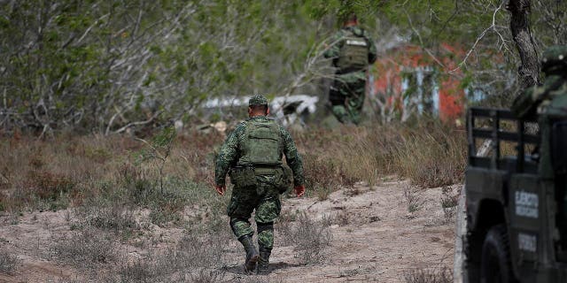 Military personnel walk at the scene where authorities found the bodies of two of four Americans kidnapped by gunmen, in Matamoros, Mexico March 7, 2023.