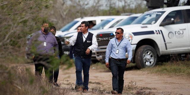 Tamaulipas attorney general's office personnel walk at the scene where authorities found the bodies of two of four Americans kidnapped by gunmen, in Matamoros, Mexico March 7, 2023.