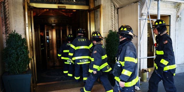 New York City Fire Department (FDNY) firefighters enter The Sherry-Netherland hotel residence after a fire broke out on the 18th floor, where exiled Chinese businessman Guo Wengui has an apartment, following his arrest earlier in the day in Manhattan in New York City, New York, U.S., March 15, 2023.
