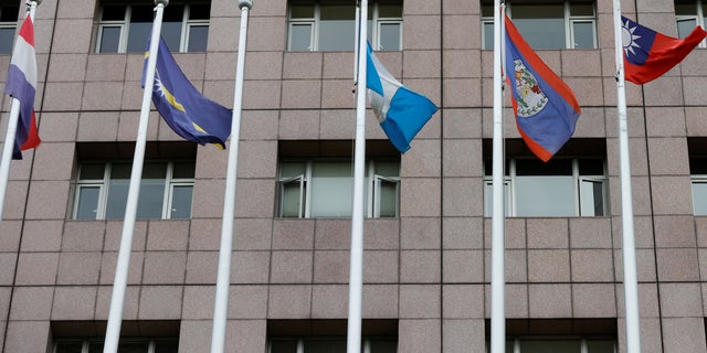 An empty flag pole where the Honduran flag used to fly is pictured next to flags of other countries at the Diplomatic Quarter which houses embassies in Taipei, Taiwan March 26, 2023. 