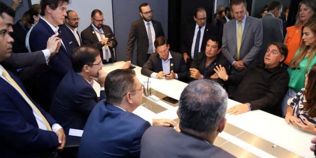 Brazil's former president, Jair Bolsonaro, attends a meeting with members of his party and allies after returning from self-imposed exile in Florida to Brasilia, Brazil, on March 30, 2023.