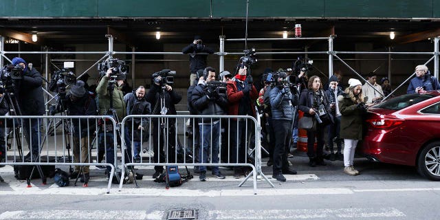 Members of the media gather following the indictment of former US President Donald Trump by a Manhattan grand jury following an investigation into hush money paid to porn star Stormy Daniels, in New York City, the United States, March 30, 2023.  
