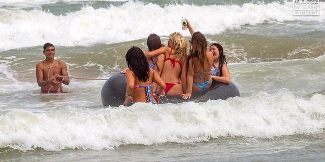 Revelers enjoy the surf and sand on San Padre Island, Texas, Wednesday, March 15, 2023. The beach is a popular destination for spring break. Photo: KR/Mega for Fox News Digital