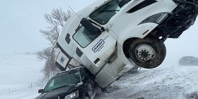 Snowy conditions led to this collision between a semi-truck and a State Trooper on March 18th. (Source: South Dakota Highway Patrol via Facebook)