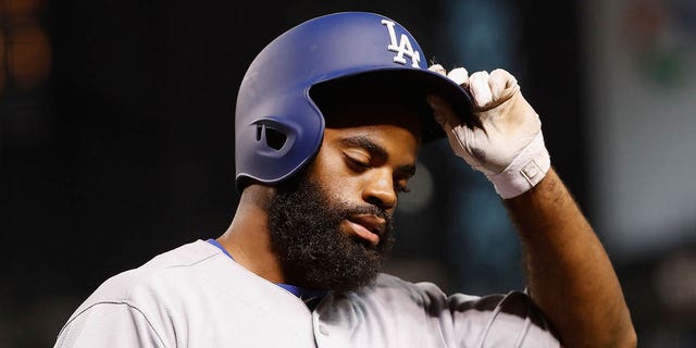 Andrew Toles of the Los Angeles Dodgers reacts after striking out against the Arizona Diamondbacks during the eighth inning of a game at Chase Field on August 16, 2016 in Phoenix, Arizona.  