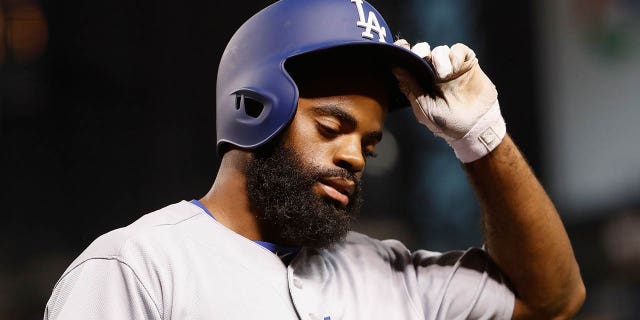 Andrew Toles of the Los Angeles Dodgers reacts after striking out against the Arizona Diamondbacks during the eighth inning of a game at Chase Field on August 16, 2016 in Phoenix, Arizona.  